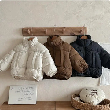 Child wearing 2025 winter cotton-padded jacket
