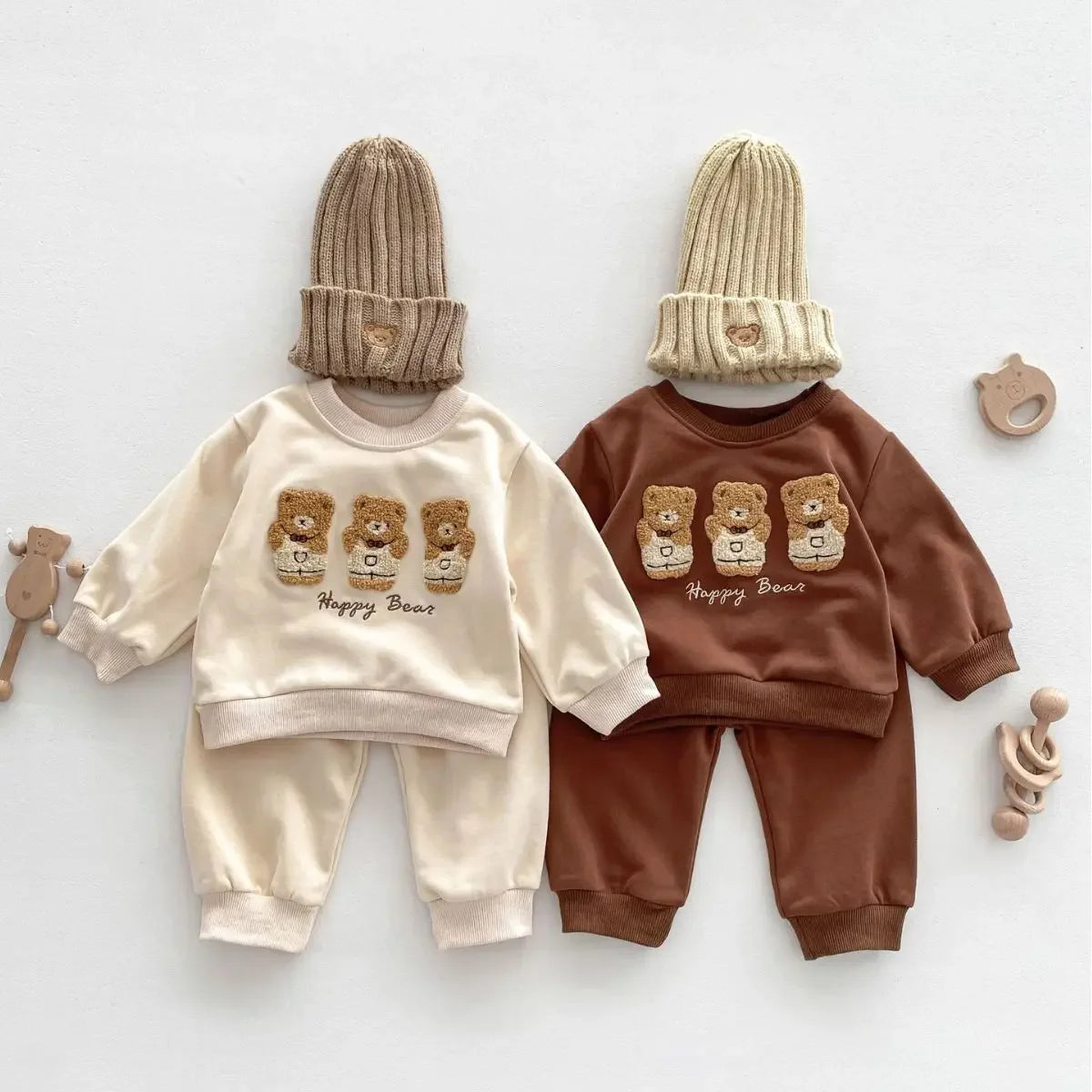 Baby wearing autumn tracksuit with teddy bear print
