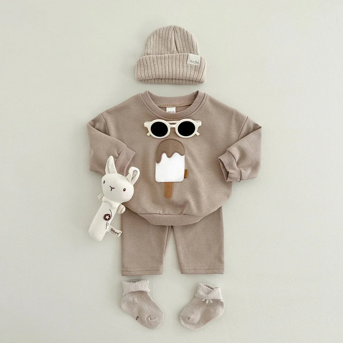 Baby wearing autumn tracksuit with bear print
